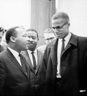 Malcom X towers impressively over Martin Luther King.