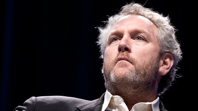 AN IMPRESSIVE WAX REPLICA OF ANDREW BREITBART SHINES GLORY UPON THOSE WHO MUST LIVE OUT THE INESCAPABLE DAMNATION OF HIS ABSENCE.