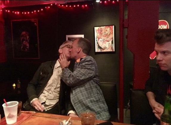 Andy Dick's stiff right hand and unnatural pose express discomfort as Doug Stanhope forces himself on the comic. Comedian Anthony Jeselnik (right) looks on, doing nothing. (Photo credit: Brett Erickson)