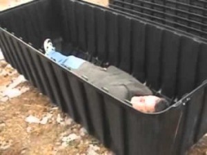 American Ebola patient is seen in plastic FEMA style coffin.