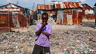 Before the earthquake, Haitians live under rusty sheet metal. Guess they'll have to put it back up.