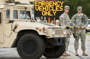 Roanoke County Va. police officers cower behind one of only four humvees, and await public insurrection.