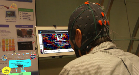 Edward Snowden accesses sensitive files using a mind-computer interface. It would suck to be blind right now, because this picture looks pretty cool.